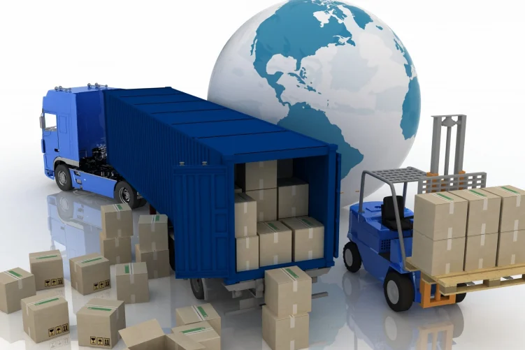  A blue semi-truck with an open shipping container full of boxes, surrounded by more stacked boxes and a forklift, with a large globe in the background.