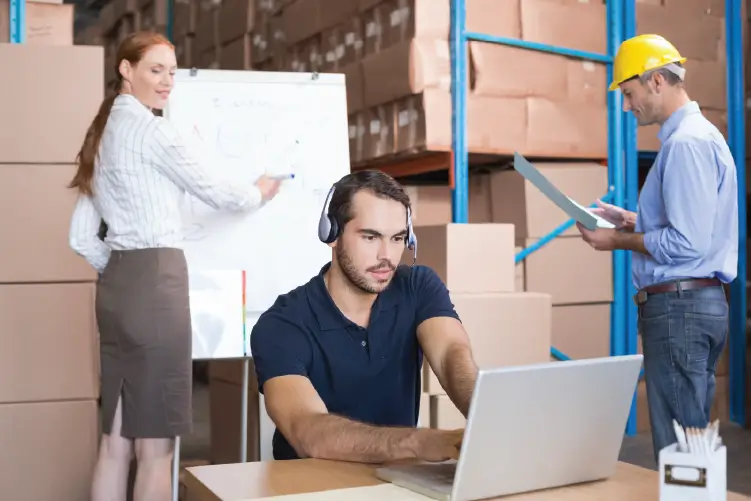 employees managing logistics and package loading in a warehouse for efficient freight services