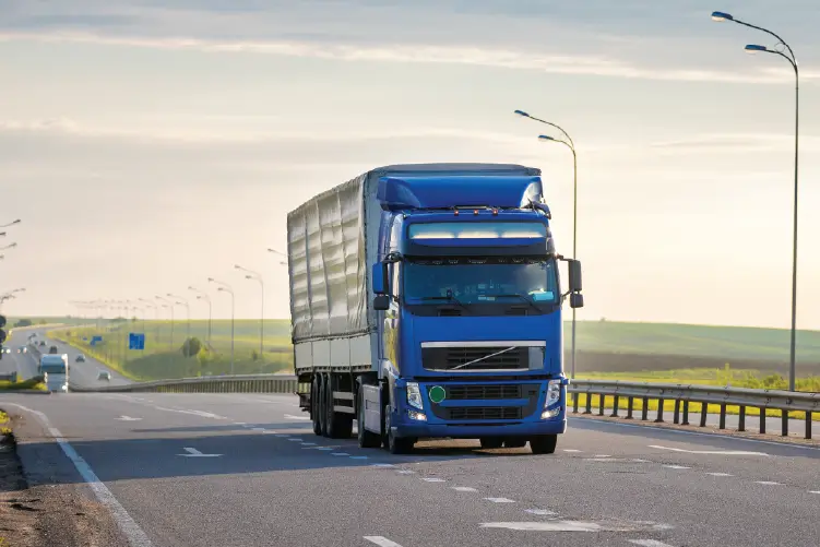 Trucking's driving on a highway, showcasing our dependable service for Melbourne to Sydney freight.