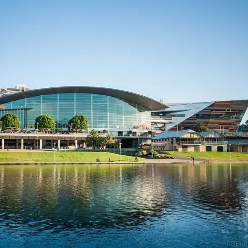 Scenic view of a Scenic view of a modern building in South Australia with a waterfront, representing reliable freight transport services across the region.